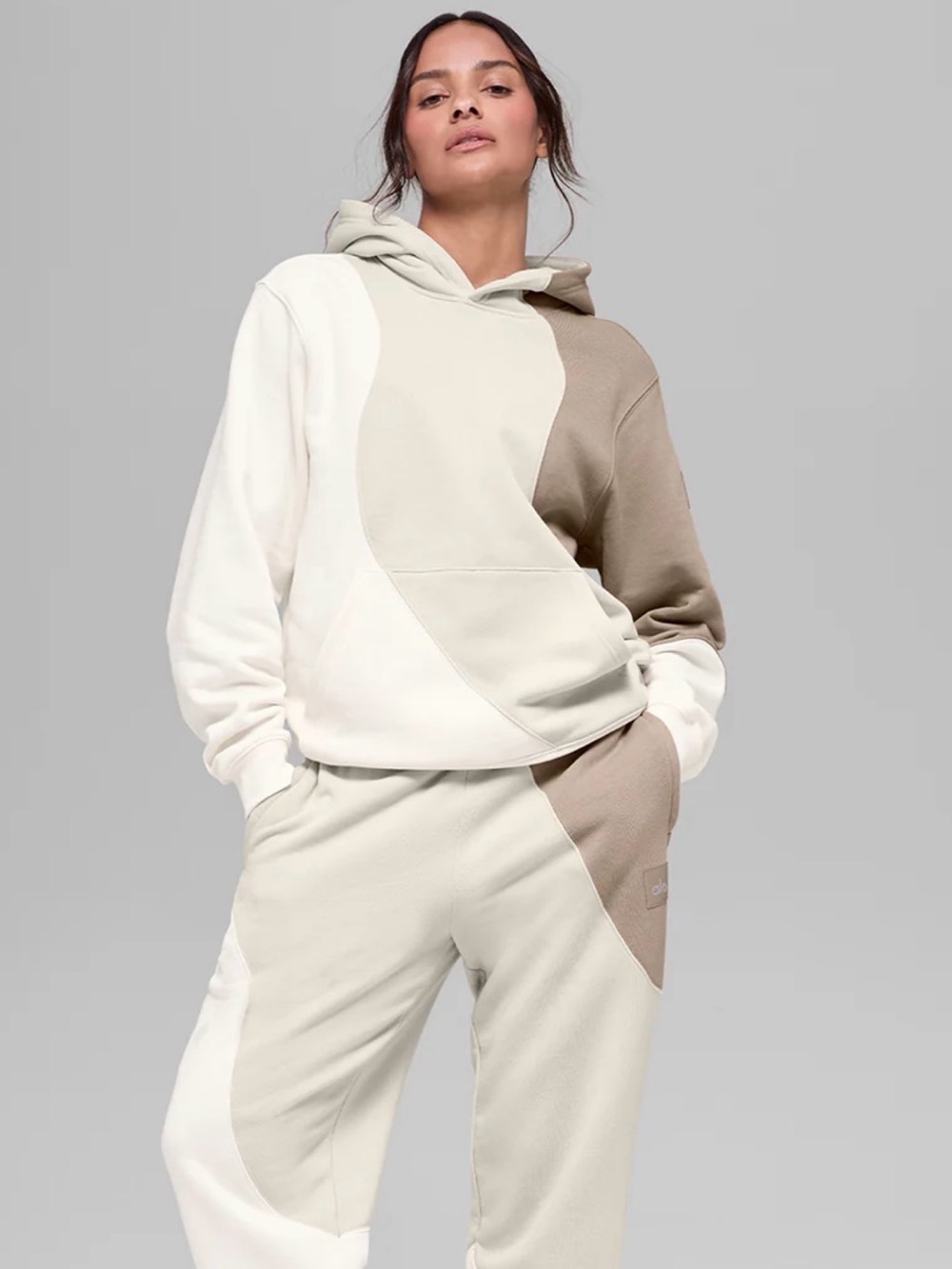 ALO Yoga Cream and Tan Colorblock Hoodie also have the tan pants to match